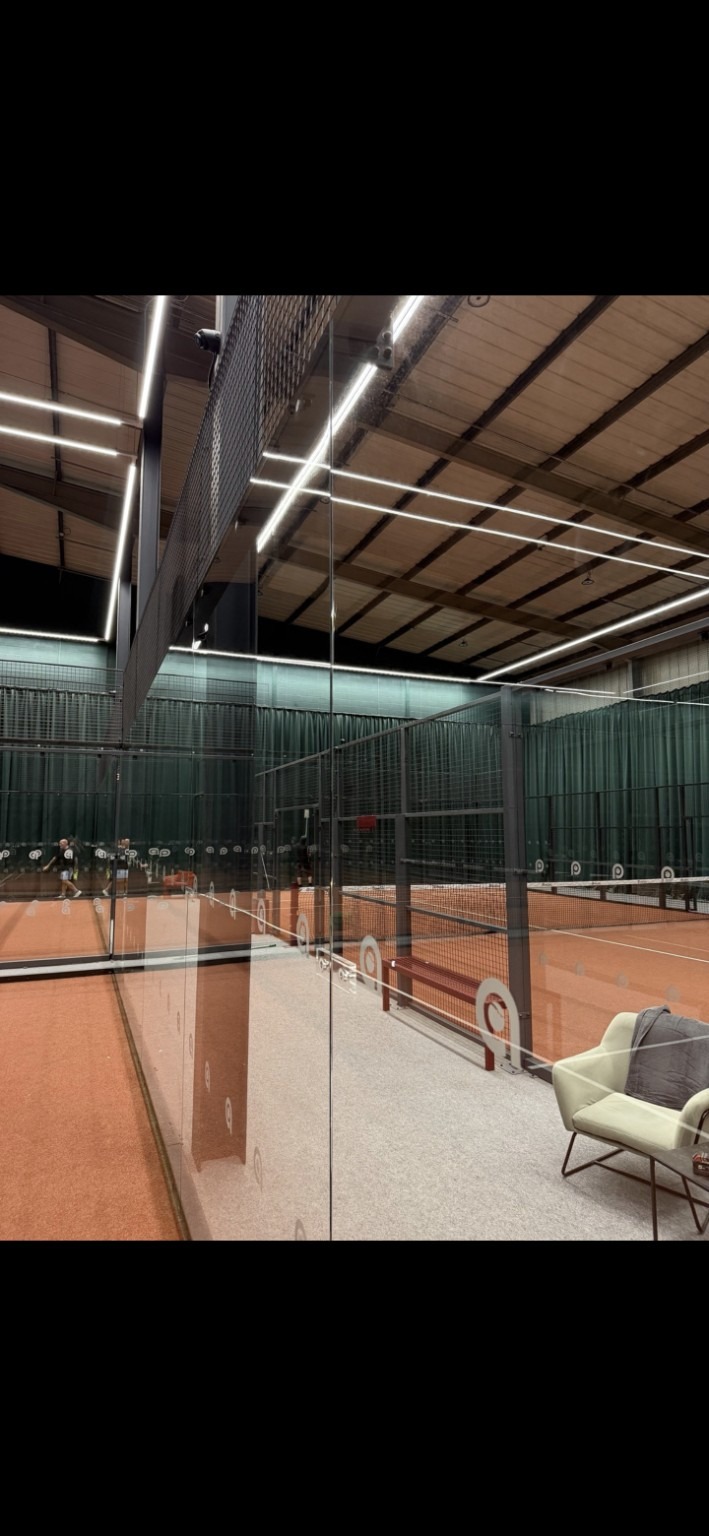 Clean padel court glass after professional cleaning
